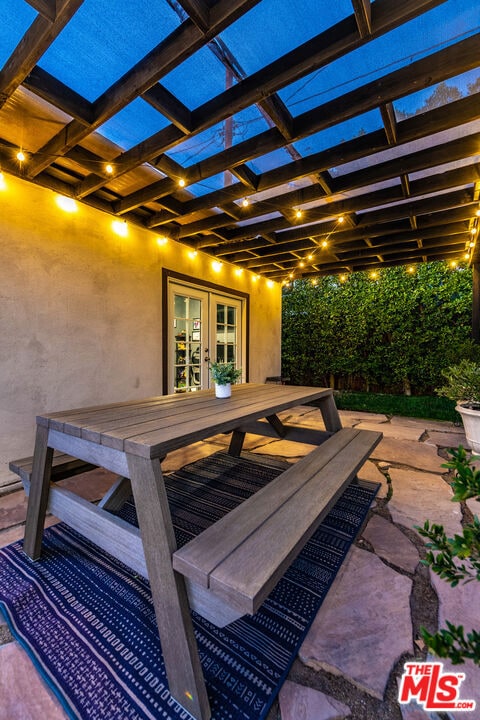 view of patio / terrace featuring french doors and a pergola