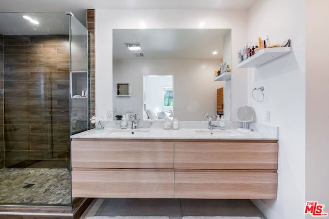 bathroom with an enclosed shower and vanity