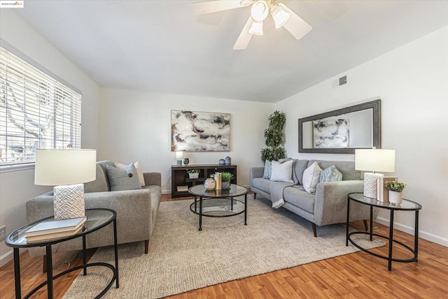 living room with ceiling fan and wood-type flooring