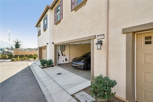 view of side of home with a garage