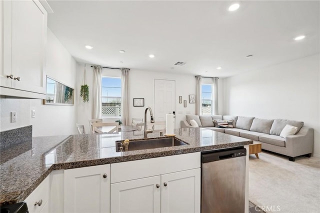 kitchen featuring white cabinetry, sink, and stainless steel dishwasher