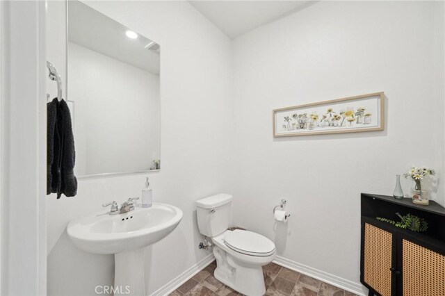 34495 Agave Dr Unit 1103, Winchester, CA 92596 - bathroom featuring baseboards, a sink, and toilet