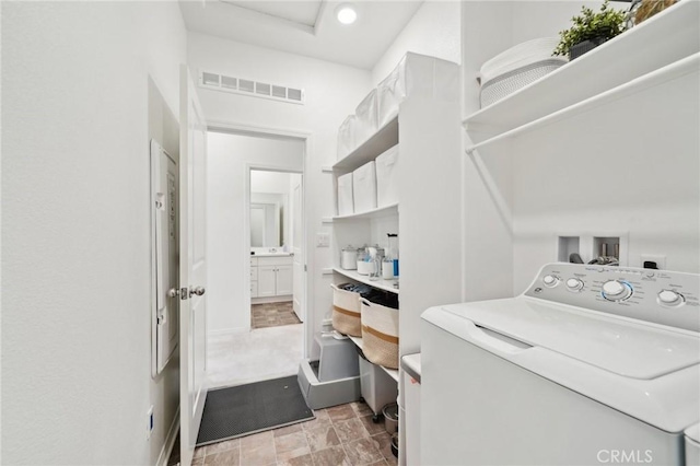 34495 Agave Dr Unit 1103, Winchester, CA 92596 - laundry room featuring washer / dryer, laundry area, visible vents, and baseboards