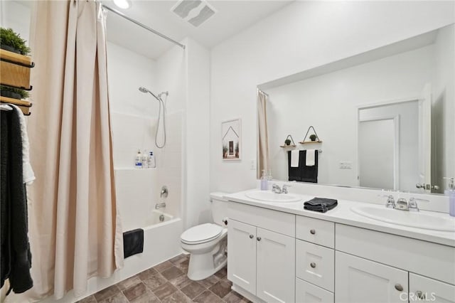 full bathroom featuring vanity, toilet, and shower / bath combo with shower curtain