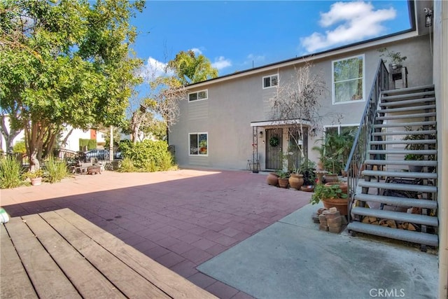 back of property featuring a patio