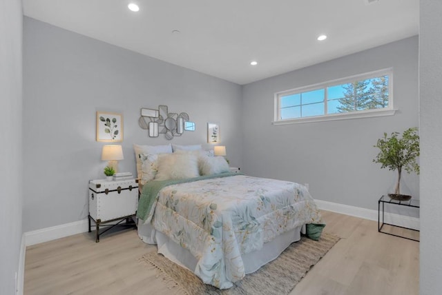 bedroom with light hardwood / wood-style floors