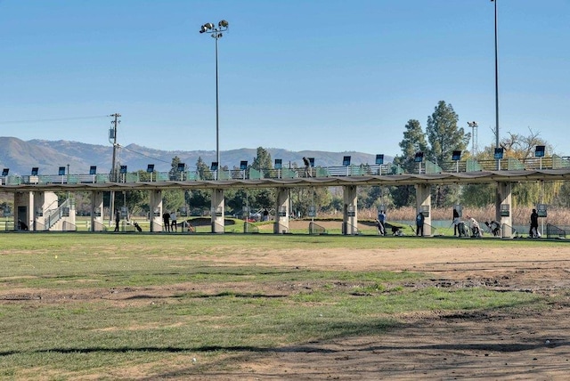 view of property's community featuring a mountain view and a lawn