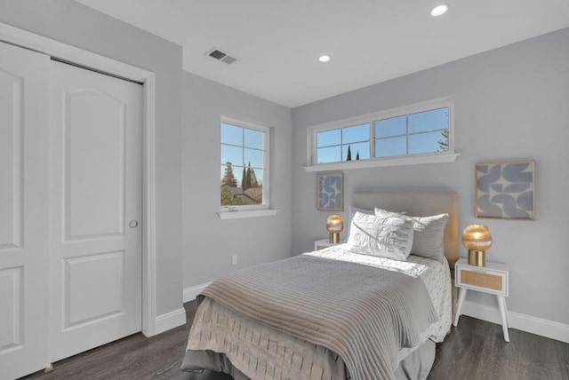 bedroom featuring dark hardwood / wood-style flooring