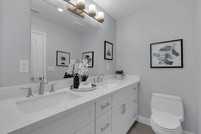 bathroom with toilet and vanity