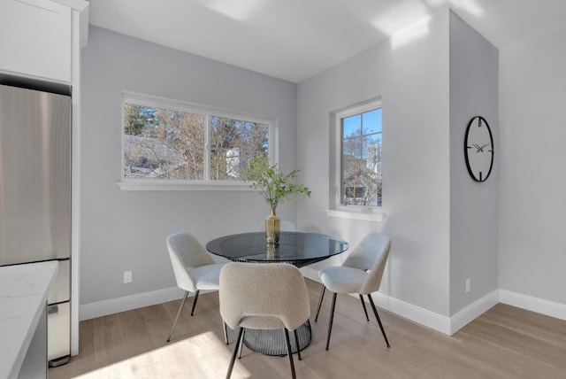 dining area with light wood-type flooring