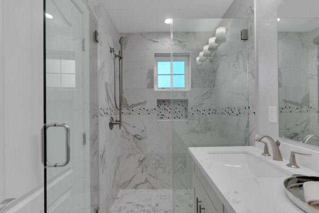 bathroom featuring vanity and walk in shower