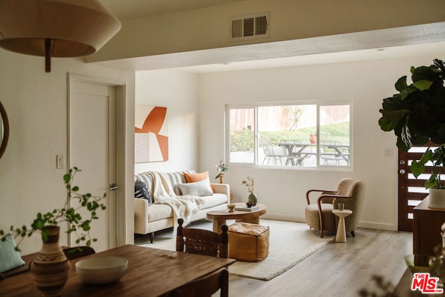 sitting room featuring light wood-type flooring