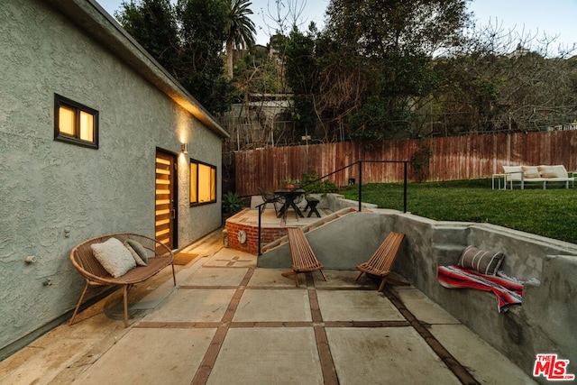 view of patio / terrace with a fire pit