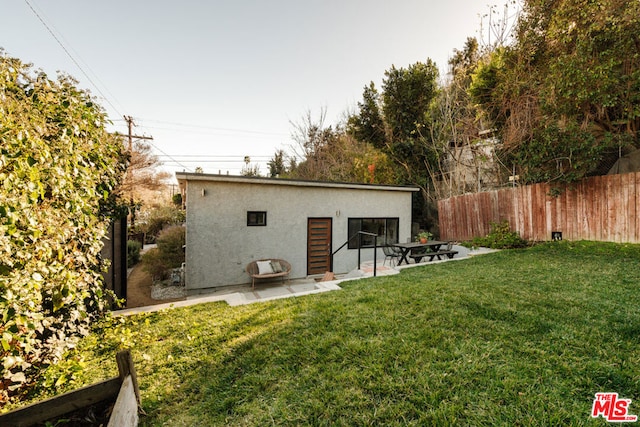 exterior space featuring a yard and a patio