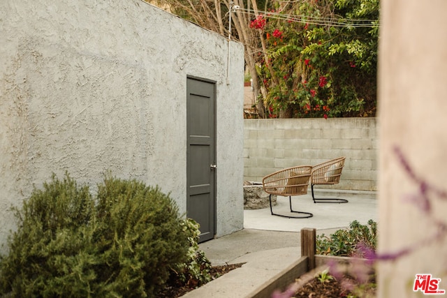 doorway to property with a patio