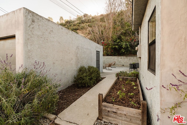 view of property exterior featuring a patio area