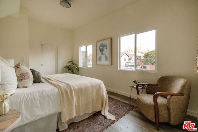 bedroom with hardwood / wood-style floors