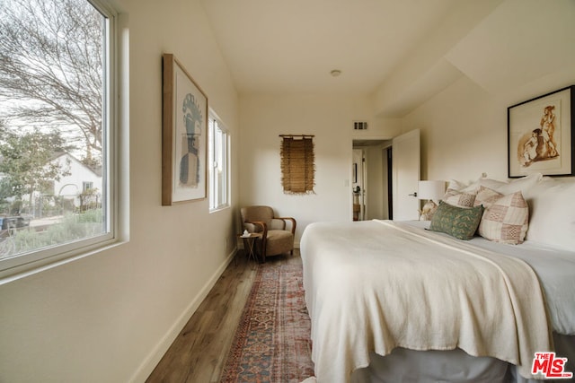 bedroom featuring dark wood-type flooring