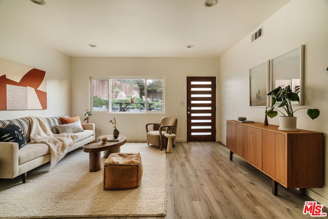 living room with light hardwood / wood-style floors