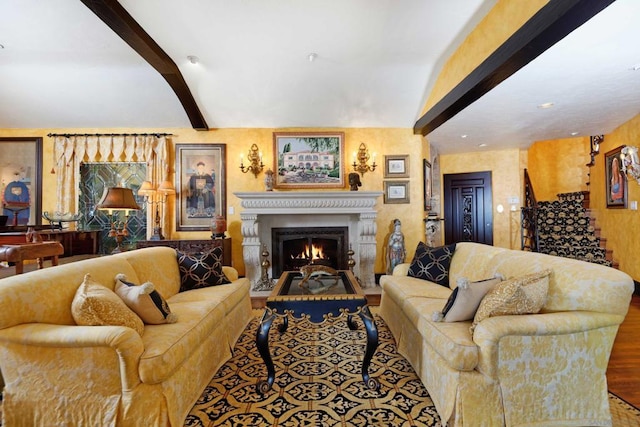 living room with vaulted ceiling with beams