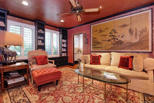 living room featuring ceiling fan, light hardwood / wood-style flooring, and ornamental molding