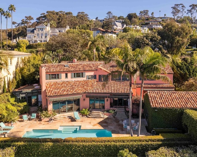 rear view of house with a patio