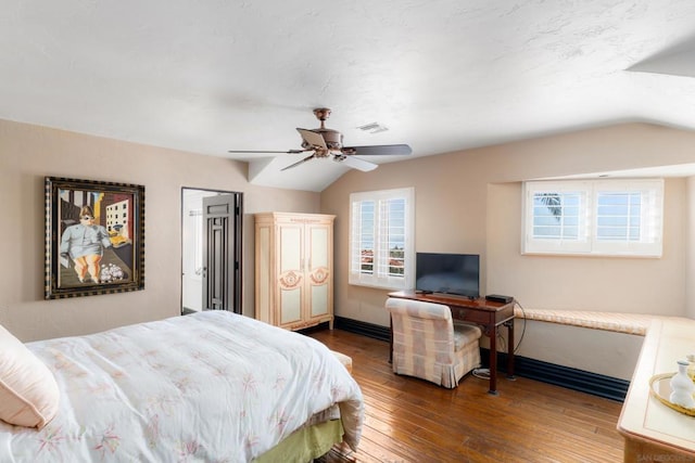 bedroom with lofted ceiling, dark hardwood / wood-style floors, and ceiling fan