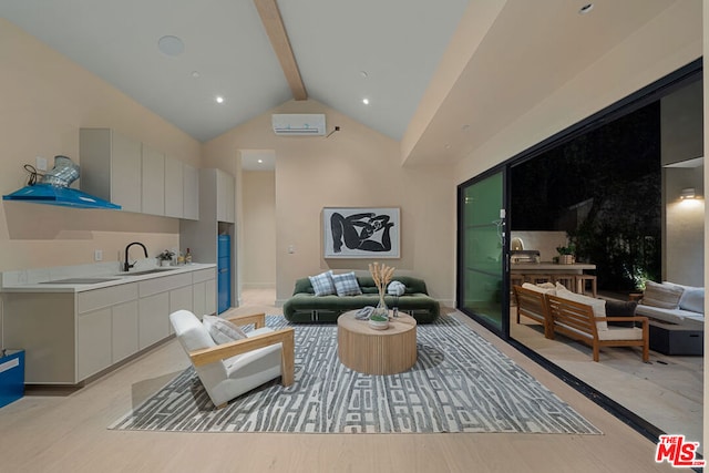 living room featuring sink, beam ceiling, light hardwood / wood-style flooring, and high vaulted ceiling