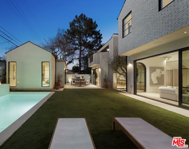 view of yard with outdoor lounge area and a patio