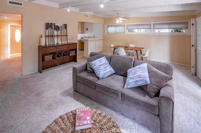 carpeted living room with wood ceiling, ceiling fan, and beamed ceiling