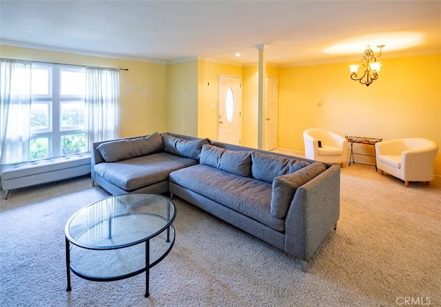 carpeted living room with ornate columns, a chandelier, crown molding, and a baseboard radiator