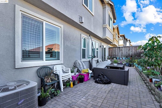 view of patio with an outdoor hangout area and central AC unit