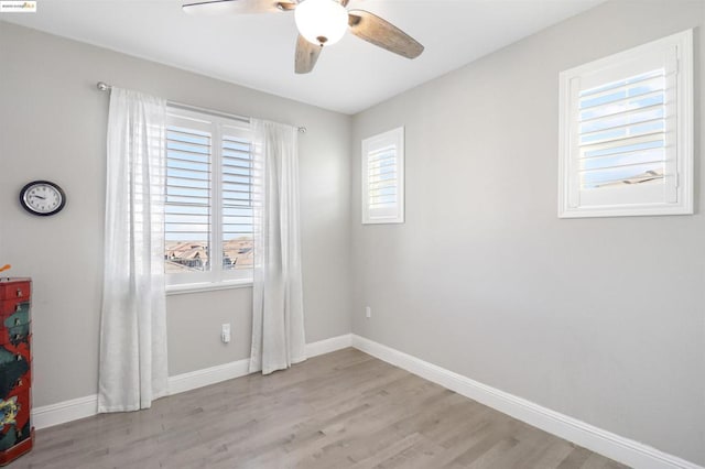 spare room with ceiling fan and light hardwood / wood-style floors