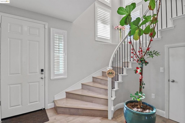 entryway with hardwood / wood-style flooring