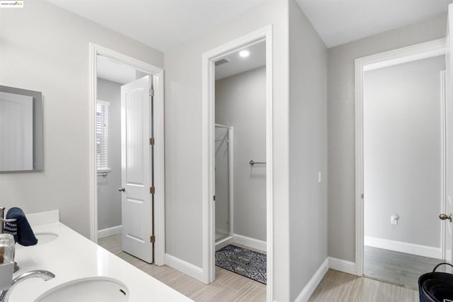 bathroom featuring vanity and hardwood / wood-style floors