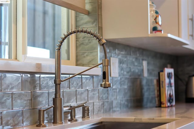 room details featuring sink and backsplash