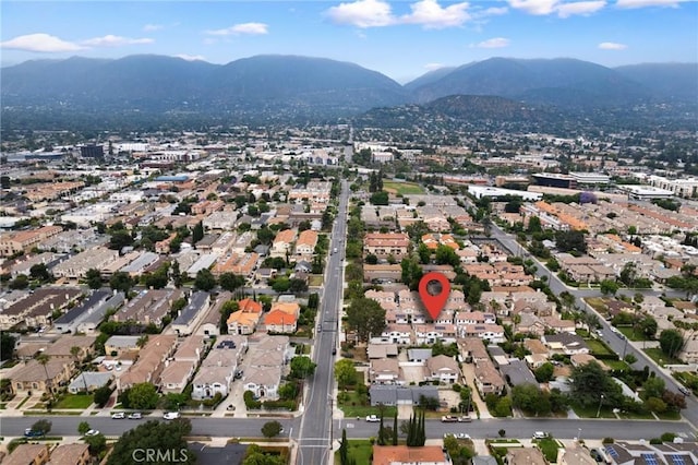 birds eye view of property with a mountain view