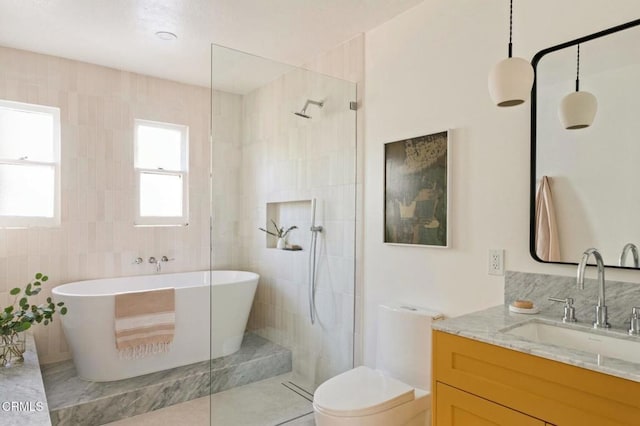 full bathroom featuring tile patterned floors, vanity, shower with separate bathtub, tile walls, and toilet