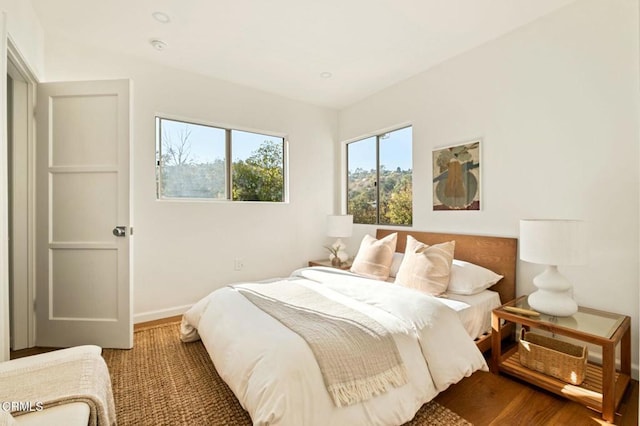 bedroom with hardwood / wood-style floors