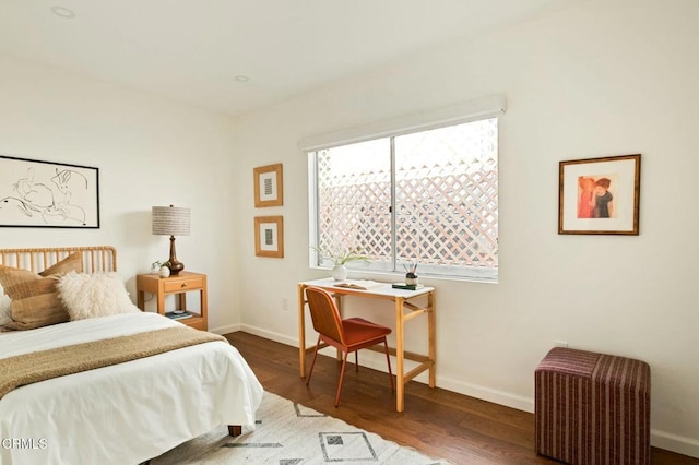 bedroom featuring dark hardwood / wood-style flooring