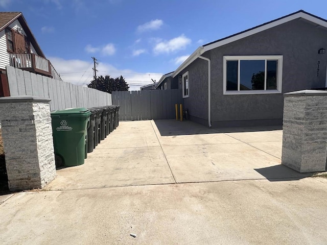 view of property exterior featuring a patio area