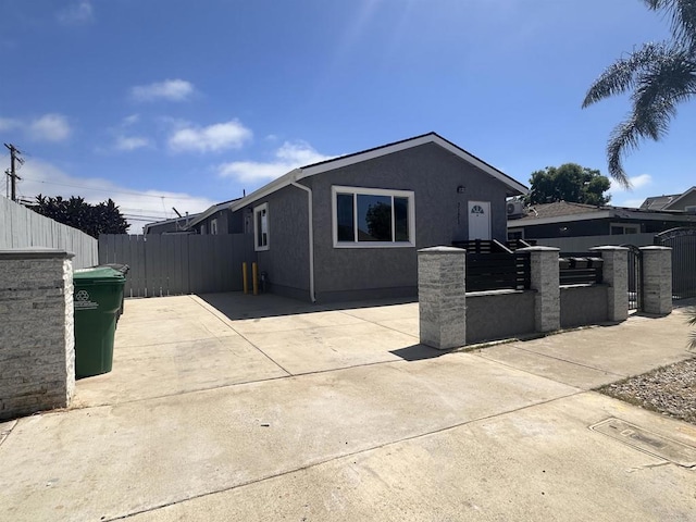 view of side of home featuring a patio