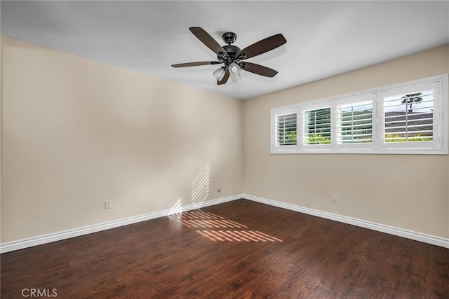 unfurnished room featuring ceiling fan and dark hardwood / wood-style floors