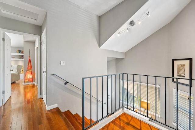 stairs with wood-type flooring