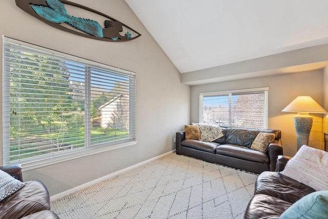 living room featuring lofted ceiling and light colored carpet