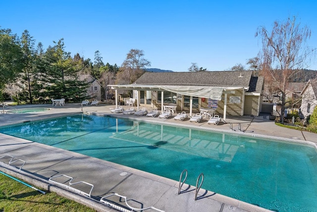 view of swimming pool featuring a patio area