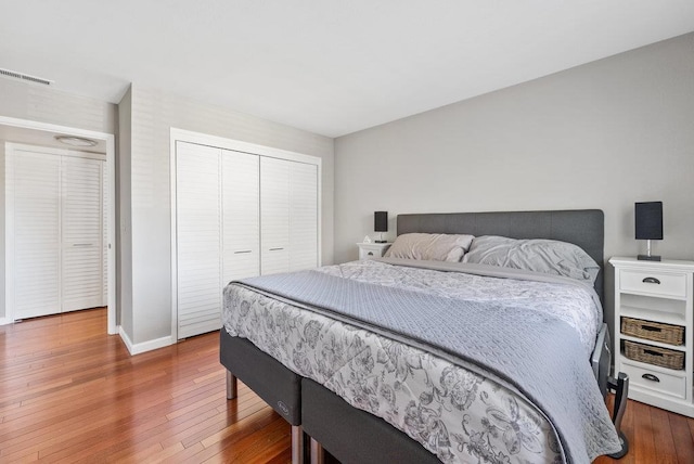 bedroom featuring hardwood / wood-style flooring and a closet