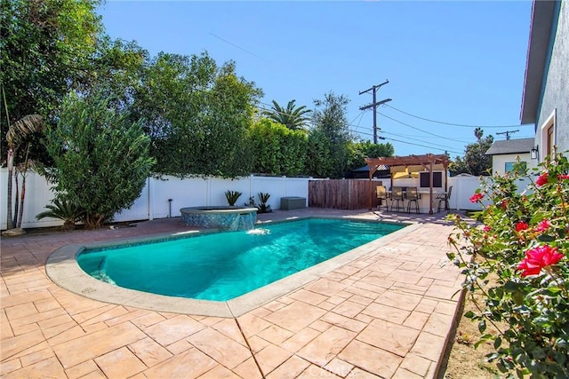 view of pool featuring an in ground hot tub, a patio area, a bar, and pool water feature