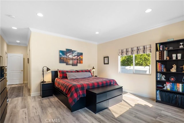 bedroom featuring light wood-type flooring and crown molding