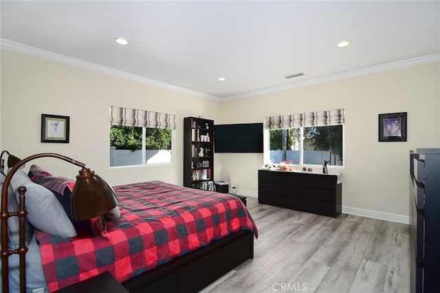 bedroom with crown molding and hardwood / wood-style flooring